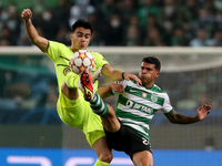 Reinier of Borussia Dortmund (L) vies with Pedro Porro of Sporting CP during the UEFA Champions League Group C football match between Sporti...
