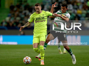 Marco Reus of Borussia Dortmund (L) vies with Matheus Nunes of Sporting CP during the UEFA Champions League Group C football match between S...