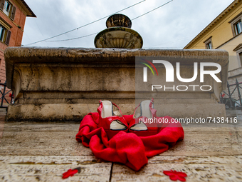 The red shoe, the symbol of this International Day for the Elimination of Violence against Women, on the fountain in Piazza Vittorio Emanuel...