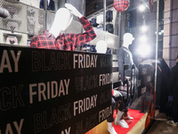 Black friday signs are seen at the storefront in Milan, Italy on November 25, 2021. (
