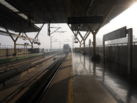 A Delhi metro train approaches towards a platform on a cold winter morning in New Delhi, India on November 26, 2021.  (