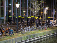 Protest against the Covid-19 measures in The Hague in front of Den Haag Centraal railway station in the city center and the canal, after the...