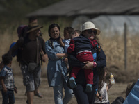 A young migrant mother arrives at  the new refugee camp at the Macedonian-Greek border, August 23 2015, near the town of Gevgelija. Macedoni...