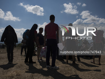 Migrants are waiting for documents at  the new refugee camp at the Macedonian-Greek border, August 23 2015, near the town of Gevgelija. Mace...