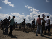 Migrants are waiting for documents at  the new refugee camp at the Macedonian-Greek border, August 23 2015, near the town of Gevgelija. Mace...