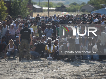 Migrants are waiting at the new refugee camp at the Macedonian-Greek border, August 23 2015, near the town of Gevgelija. Macedonia officials...