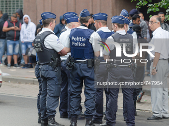 Brussels,Belgiem. 24/08/15: Asylum seekers are waiting in the early morning in front of Fedasil (federal agency for the reception of asylum...