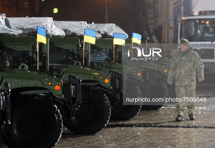 An Ukrainian serviceman walks before an official ceremony to hand over of 13 'High Mobility Multipurpose Wheeled Vehicle' (HMMWV, aka Humvee...
