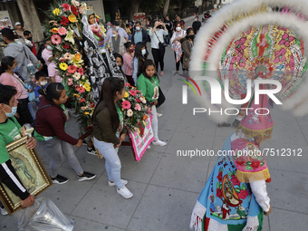 Pilgrims perform the Dance of the Quetzals outside the Basilica of Guadalupe located in the municipality of Gustavo A. Madero, Mexico City,...