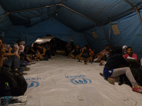 The refugees’ camp has poor facilities: only few tents for the refugees. They are waiting that local police check their ID and their Greek p...