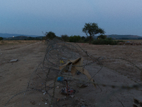 At the sunset. people are still coming from Athens  by train or by bus. They want to cross border. A new fence was built very quickly to lim...