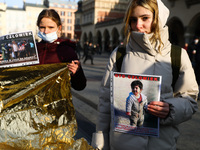 People attend 'Where is Eileen?' protest at the Main Square to demonstrate against humanitarian crisis at the Polish-Belarusian border. Krak...