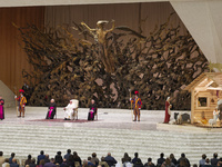 Pope Francis arrives to attend his weekly general audience in the Paul VI Hall at the Vatican, Wednesday, Dec. 15, 2021.  (