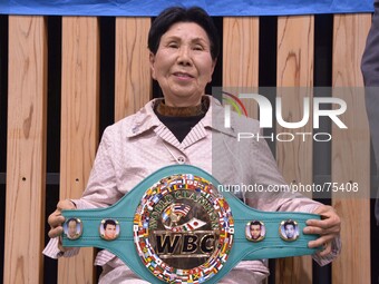 Sister of Iwao, Hideko Hakamada is conferred a WBC honor championship belt on from a Japan professional boxing association  in Tokyo April 6...