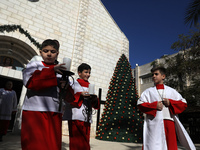  Palestinian Christians, attend a mass at the Holy Family Church in Gaza City December 19, 2021.
 (