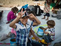 Syrian children are playing with toys and games provided by Volunteers or UNHCR or UNICEF, in Gevgelija, on August 26, 2015. 
The EU is grap...