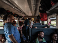Refugees inside a train for Serbia at the new transit center for migrants at the border line between Greece and Macedonia near the town of G...