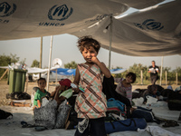 Syrian children are playing with toys and games provided by Volunteers or UNHCR or UNICEF, near the Macedonian town of Gevgelija, on August...