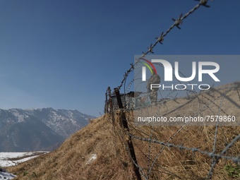 A Border Security Force (BSF) soldier stands alert at a forward post in Baramulla, Jammu and Kashmir, India on 31 December 2021. Irrespectiv...