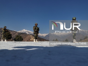 Border Security Force (BSF) soldiers stand alert at a forward post in Baramulla, Jammu and Kashmir, India on 31 December 2021. Irrespective...