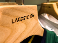 Lacoste logo is seen on clothes hanger at the store in Krakow, Poland on December 30, 2021. (