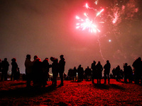 People celebrate New Year at Krakus Mound in Krakow, Poland on 1st January 2022.
 (