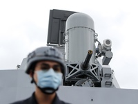 A navy soldier is seen standing guard under a machine gun on a Taiwanese military corvette during a Navy Drill for Preparedness Enhancement...
