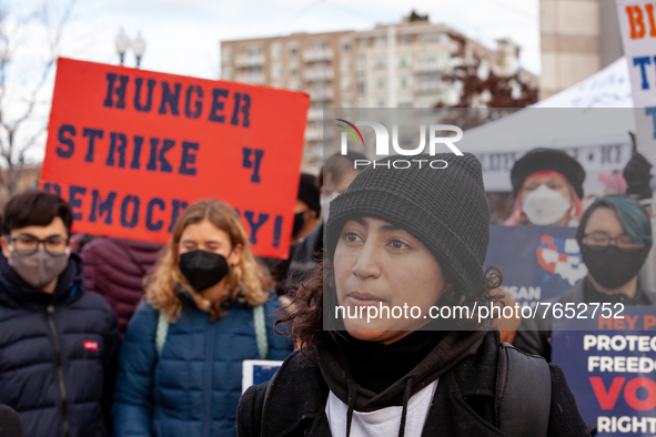 Joseline Garcia, a co-founder of UN-PAC, speaks with a reporter about the group's hunger strike for voting rights at the DC Peace Walk.  She...