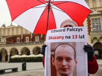 A banner with Belarusian activist and opposition blogger Eduard Palczys, sentenced to 13 years in prison, is seen during a demonstrate of so...