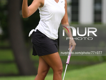 Cheyenne Woods of Phoenix, Arizona greets the gallery after making her putt on the 14th green during the second round of the Marathon LPGA C...