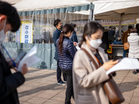 Citizens wait for the results of the COVID-19 test in front of Seoul Metropolitan Government Hall on February 9, 2022 in Seoul, South Korea....