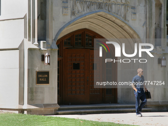 Student outside Dillon Hall at the Assumption College building of the University of Windsor in Ontario, Canada. (