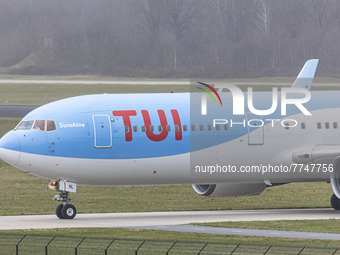 Close-up at the cockpit with the red logo inscription visible. TUI Airlines Belgium Boeing 767-300ER aircraft as seen on final approach flyi...
