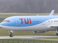 Close-up at the cockpit with the red logo inscription visible. TUI Airlines Belgium Boeing 767-300ER aircraft as seen on final approach flyi...