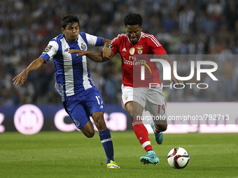 Benfica's Portuguese defender Eliseu (R) vies with Porto's Mexican forward Jesús Corona (L) during the Premier League 2015/16 match between...