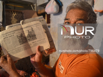 Devanand Shukla,aged 73 yrs. ,shows articles published in local newspapers of his work for cleaning the river Ganges,in Allahabad on Septemb...