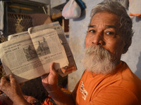 Devanand Shukla,aged 73 yrs. ,shows articles published in local newspapers of his work for cleaning the river Ganges,in Allahabad on Septemb...