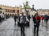 A photo of Polish composer and conductor Krzysztof Penderecki is carried during the funeral procession which walked through the Old Town in...