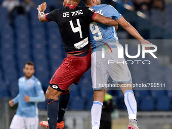 Sebastien De Maio challenges FIlip Djordjevic during the Italian Serie A match between SS Lazio and FC Genoa, at Stadio Olimpico in Rome on...