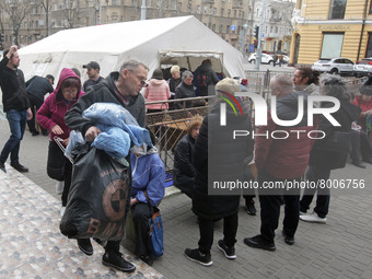 Ukrainian refugees who fled the war receive assistance at the city humanitarian volunteer center for helping refugees, amid Russia's invasio...