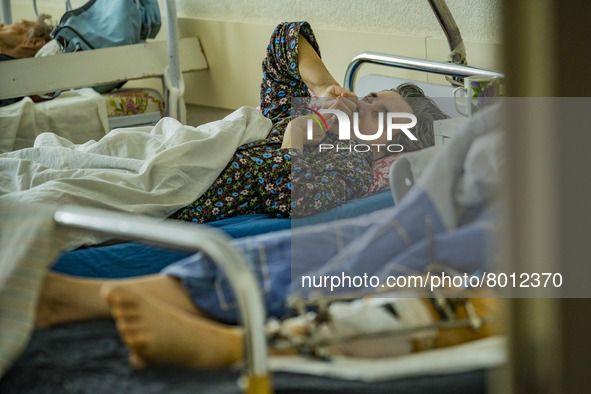 A woman wounded by the russian shelling over the city of Kharkiv in the traumatology area of a hospital of Kharkiv. 