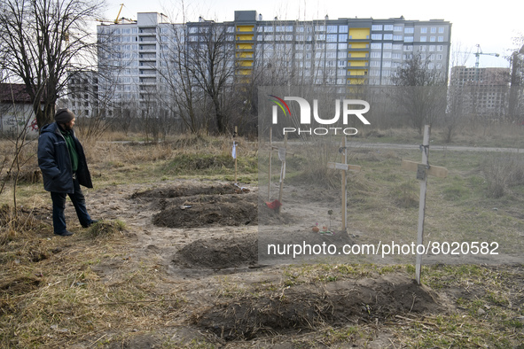 Graves with bodies of civilians next to apartments blocks in the recaptured by the Ukrainian army Bucha city near Kyiv, Ukraine, 04 April 20...
