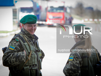 Ukrainian female border guards patrol at the BCP Customs Control Zone on the border between Ukraine and Moldova (