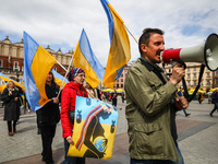 Ukrainian citizens and supporters attend a demonstration of solidarity with Ukraine at the Main Square, demanding NATO to close the sky for...
