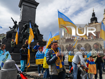 Ukrainian citizens and supporters attend a demonstration of solidarity with Ukraine at the Main Square, demanding NATO to close the sky for...