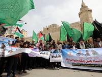 Supporters of the Palestinian Hamas and Islamic Jihad militant group rally after Friday prayers in Khan Yunis The Southern Gaza Strip, on Ap...