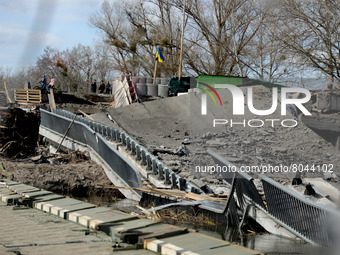 KYIV REGION, UKRAINE - APRIL 07, 2022 - A broken bridge as a result of the russian military invasion, Kyiv Region, north-central Ukraine (
