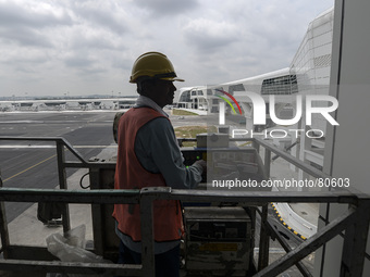  A worker prepare to cleans the exterior wall at the newly completed budget airport KLIA2, in Sepang, Malaysia,on April 12,2014.The KLIA2 wi...