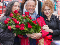Joel Grey poses at his 90th birthday celebration at Times Square TKTS Red Steps on April 11, 2022 in New York City.  (
