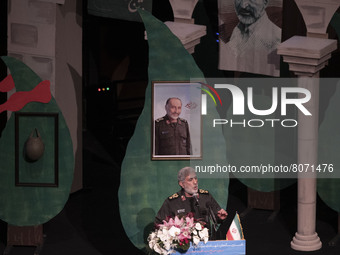 Commander of Iran’s Islamic Revolutionary Guard Corps’ (IRGC) Quds Force, Esmail Qaani, gestures as he speaks under a portrait of a killed I...